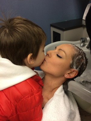 Still loves her even without the hair.